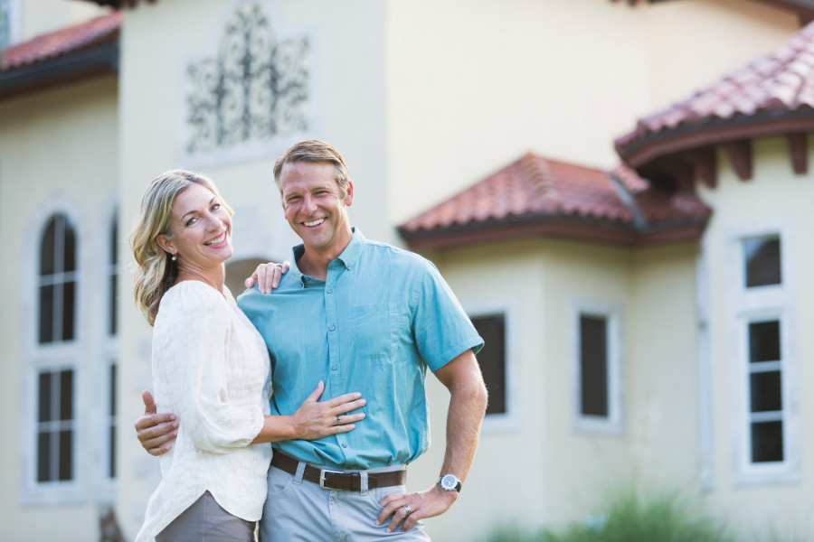 A happy couple in their Marsh Creek Country Club Home